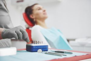 a-patient-in-a-dental-clinic-sits-in-a-chair-and-t-JV4YJVX